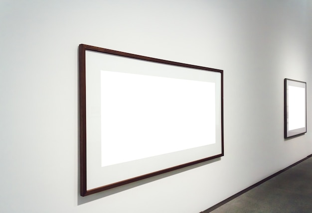 Square white surfaces attached to a wall in a room