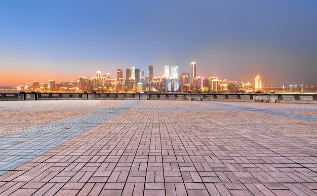 Square with the bright city in the distance