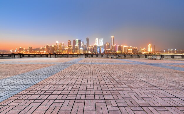 Square with the bright city in the distance