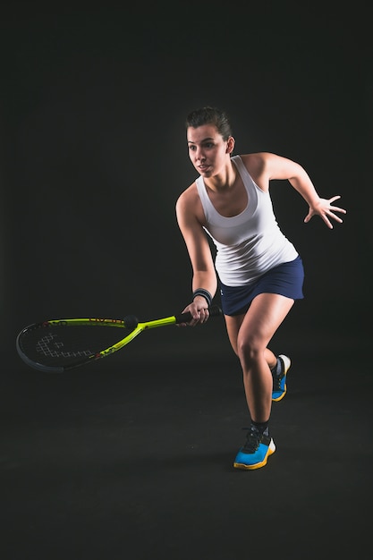 Free photo squash player hitting a ball