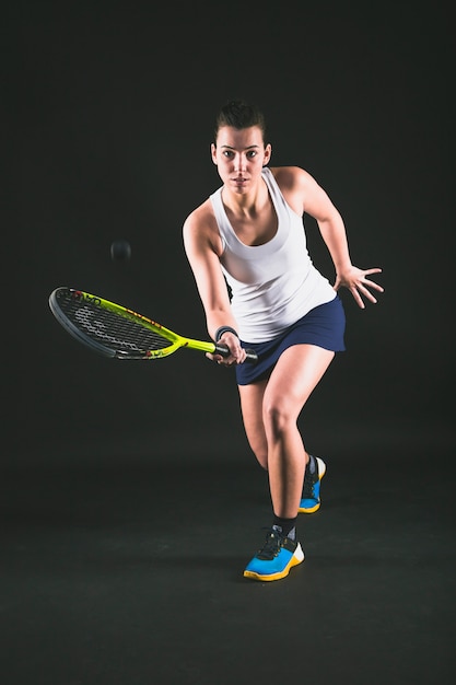 Free photo squash player returning a ball