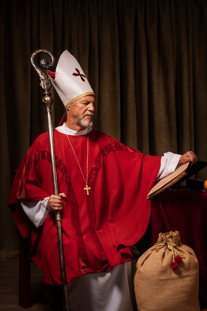 Free photo st nicholas holding cane front view