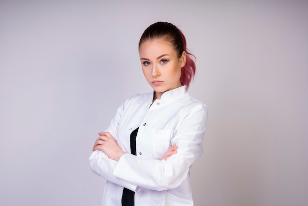 Stable girl in white doctor uniform