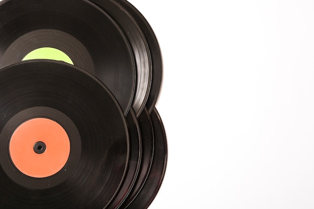 Stack of black vinyl record on white background