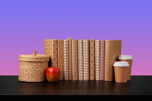 Stack of books on black wooden table