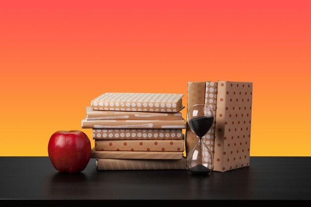 Stack of books on black wooden table