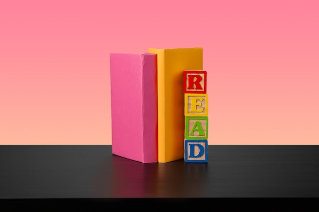 Stack of books on black wooden table