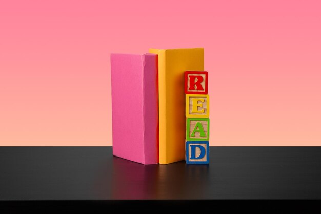 Stack of books on black wooden table