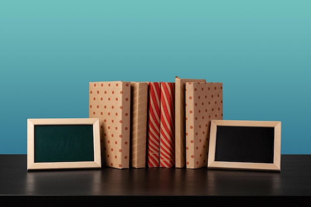 Stack of books on black wooden table