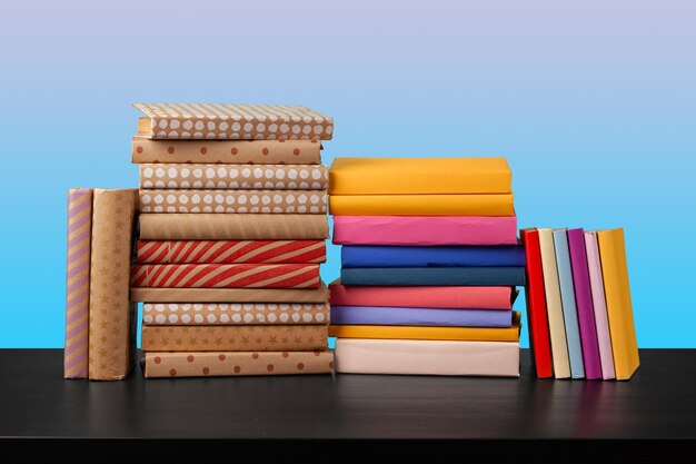 Stack of books on black wooden table