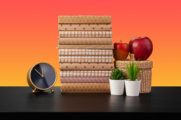 Stack of books on black wooden table