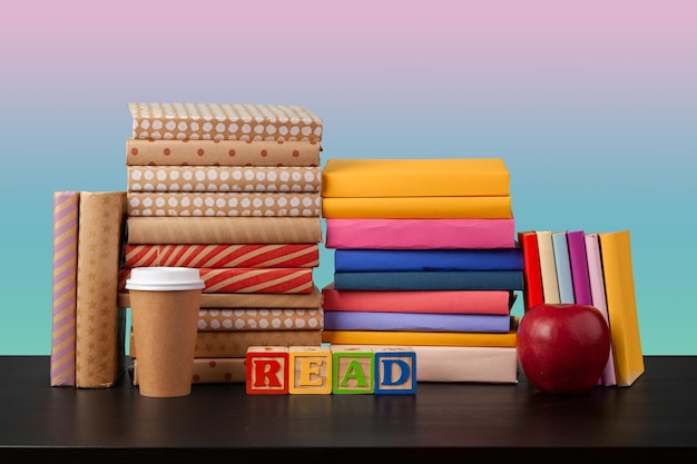 Stack of books on black wooden table