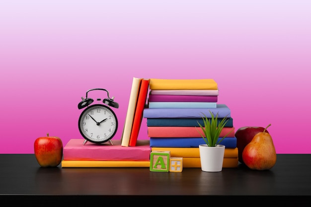 Stack of books on black wooden table