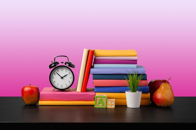 Stack of books on black wooden table