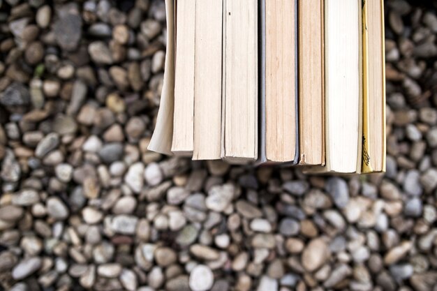 Stack of books on pebbles