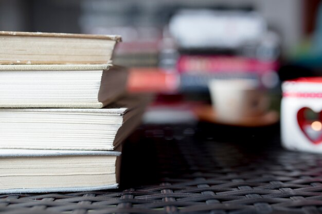 Stack of books on plastic tabletop