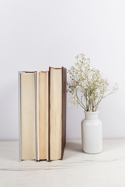 Stack of books on wooden table