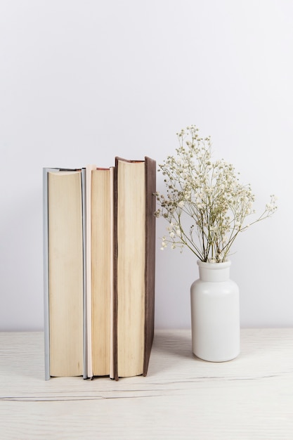 Stack of books on wooden table