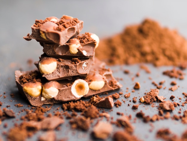 Stack of chocolate bars and cocoa powder