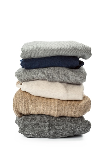 Free photo stack of clothes on white background closeup