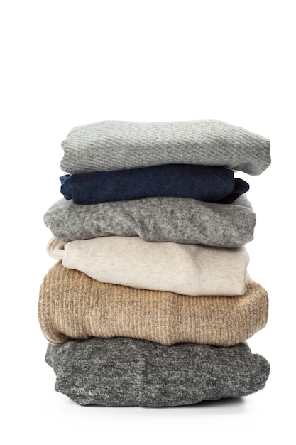 Stack of clothes on white background closeup