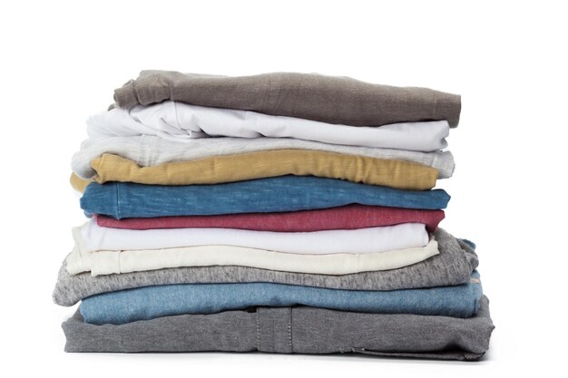 Stack of clothes on white background closeup