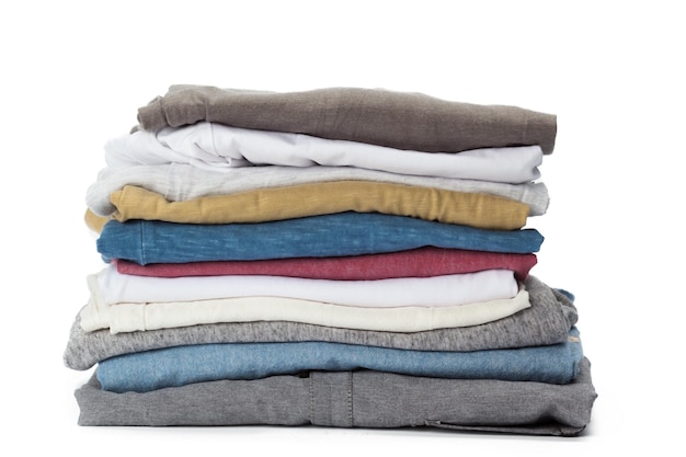 Stack of clothes on white background closeup