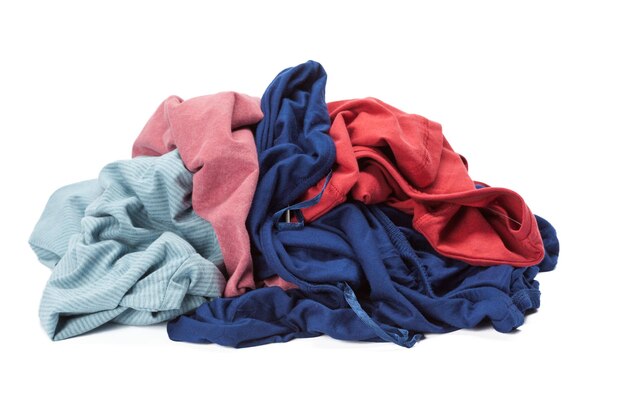 Stack of clothes on white background closeup