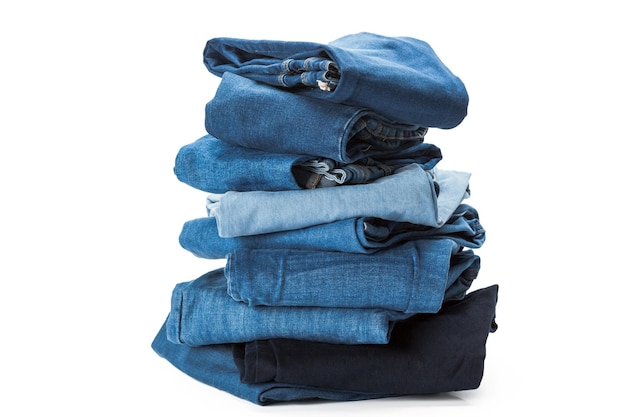 Stack of clothes on white background closeup