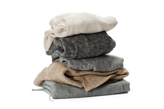 Stack of clothes on white background closeup