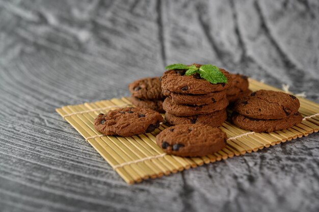 A stack of cookies on a wooden panel on a wooden table