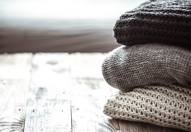 stack of cozy knitted sweaters