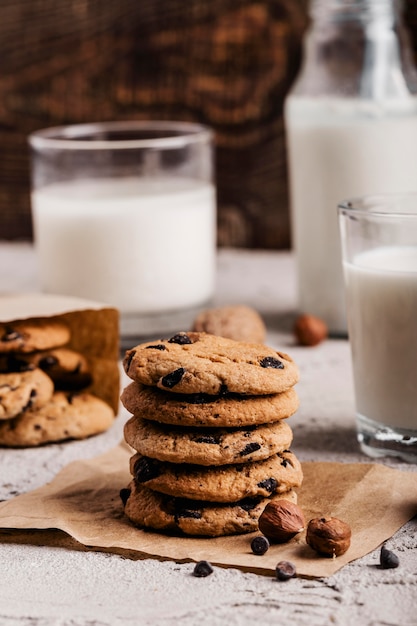 Free photo stack of delicious cookies next to glass of milk