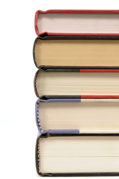 Stack of hardback books set against a white background