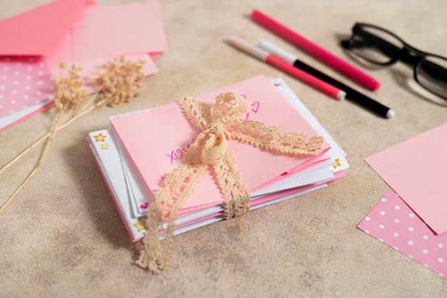 Free photo stack of love letters with ribbon