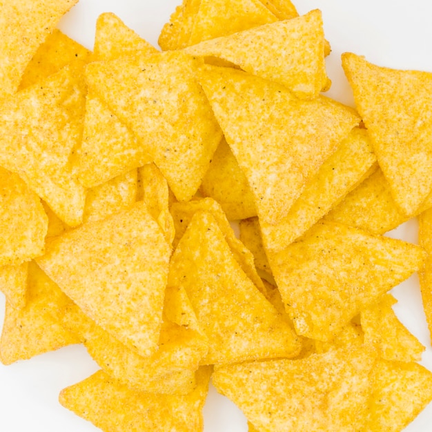 Stack of nachos on white background