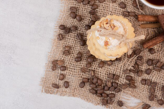 Stack of oatmeal cookies with coffee beans.