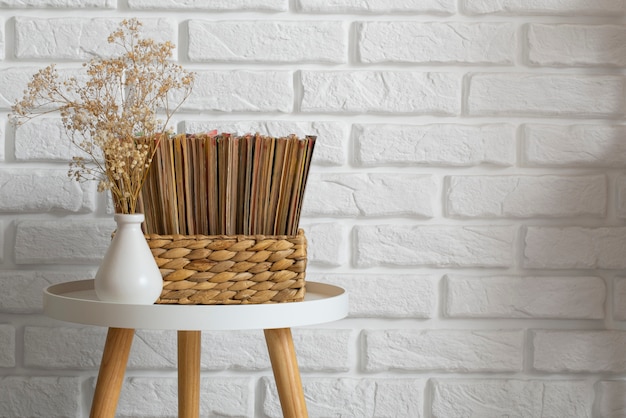 Free photo stack of old coming book strips in box on coffee table