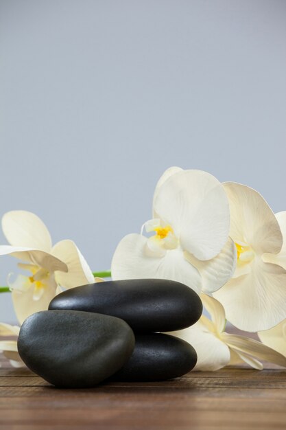 Stack of pebble stones with flowers