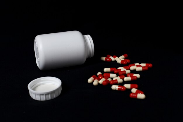 Stack of red and blue medicine capsules