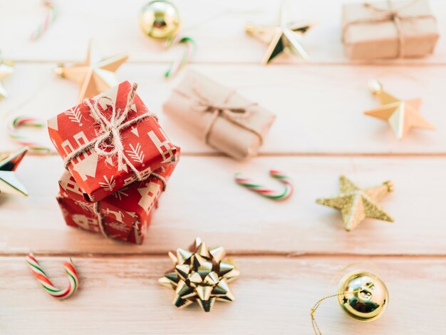 Stack of red gift boxes with Christmas toys 