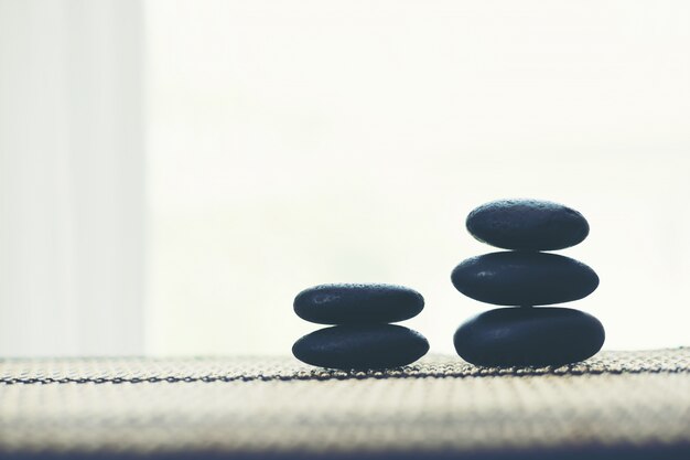 Stack of spa hot stones isolated on white background