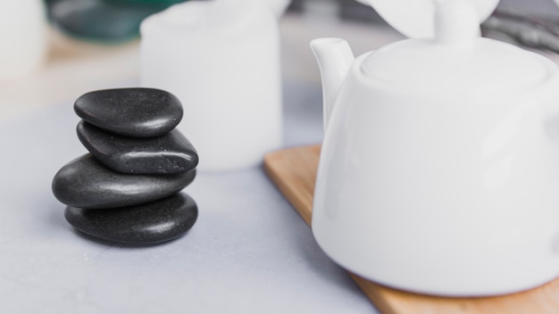 Stack of stones near teapot