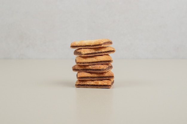 Free photo stack of sweet biscuits on gray surface