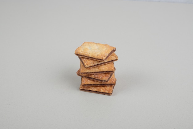 Stack of sweet biscuits on gray surface