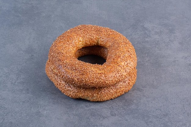 Stack of two crisp bagels on marble background. High quality photo