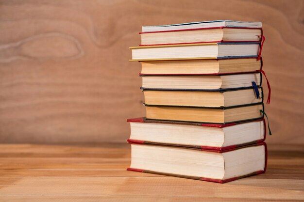 Stack of various books on a table