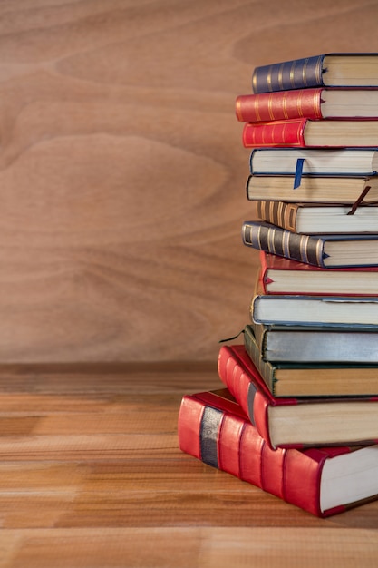 Free photo stack of various books on a table