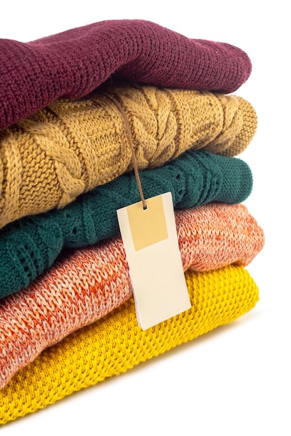 Free photo stack of various sweaters isolated on white background