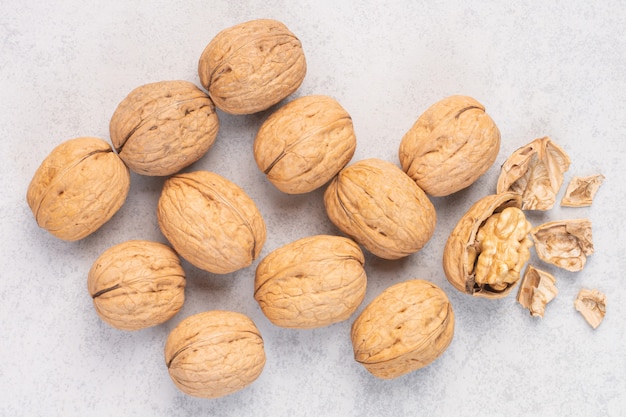 A stack of walnut , on the marble background